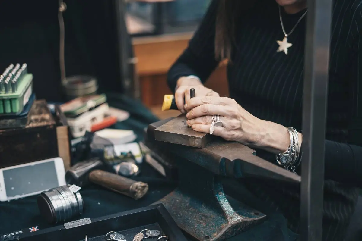 Karen Eddy crafting jewelry in her workshop